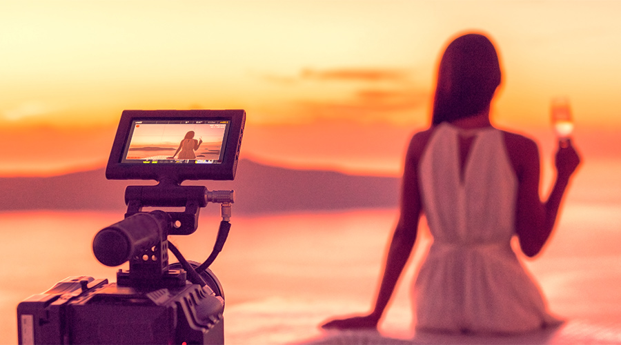 professional-videographer-recording-wedding-sunset